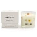 Agnes + Cat botanical candle with packaging on a white background